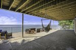 Sprawling ground level patio and deck offers plenty of seating to spread out or all hang together